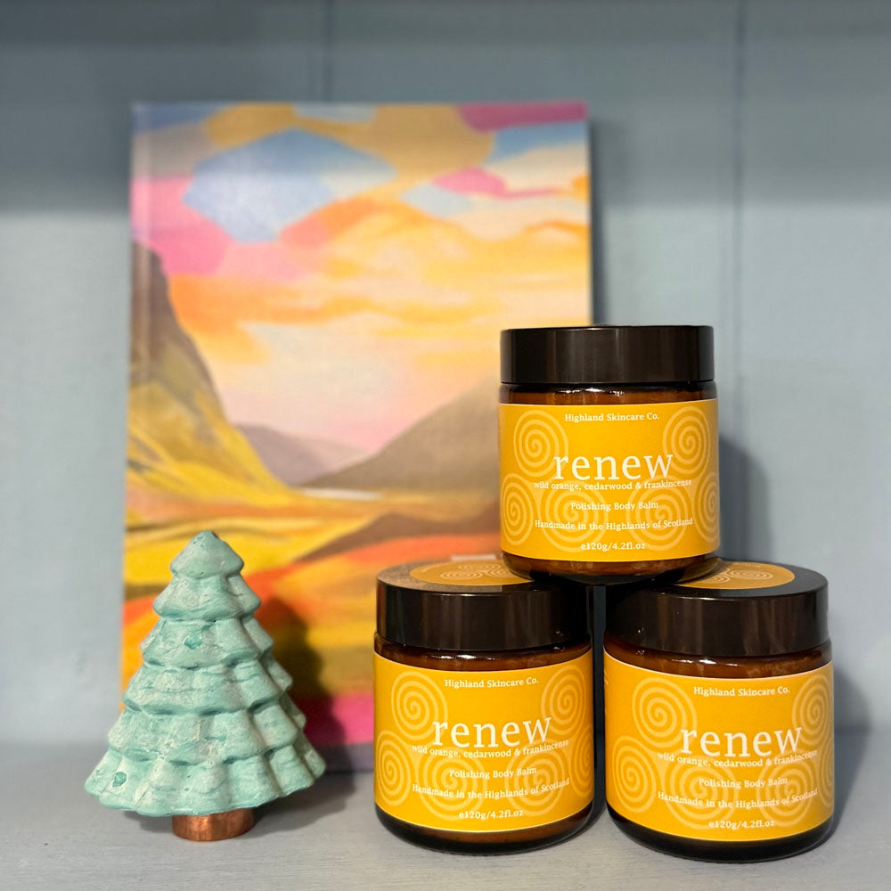 Three 'renew' jars with a decorative item and painting in the background