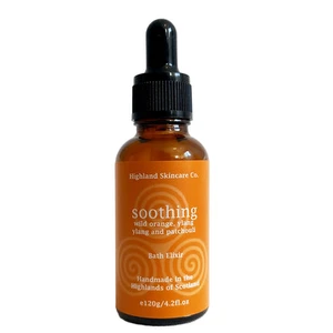 Bottle of Highland Skincare Co. soothing bath oil with dropper on a white background